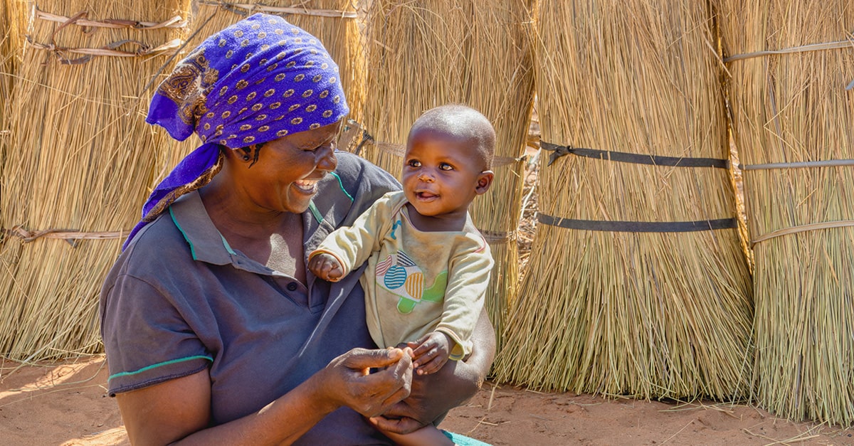 African mother and baby smiling broadly