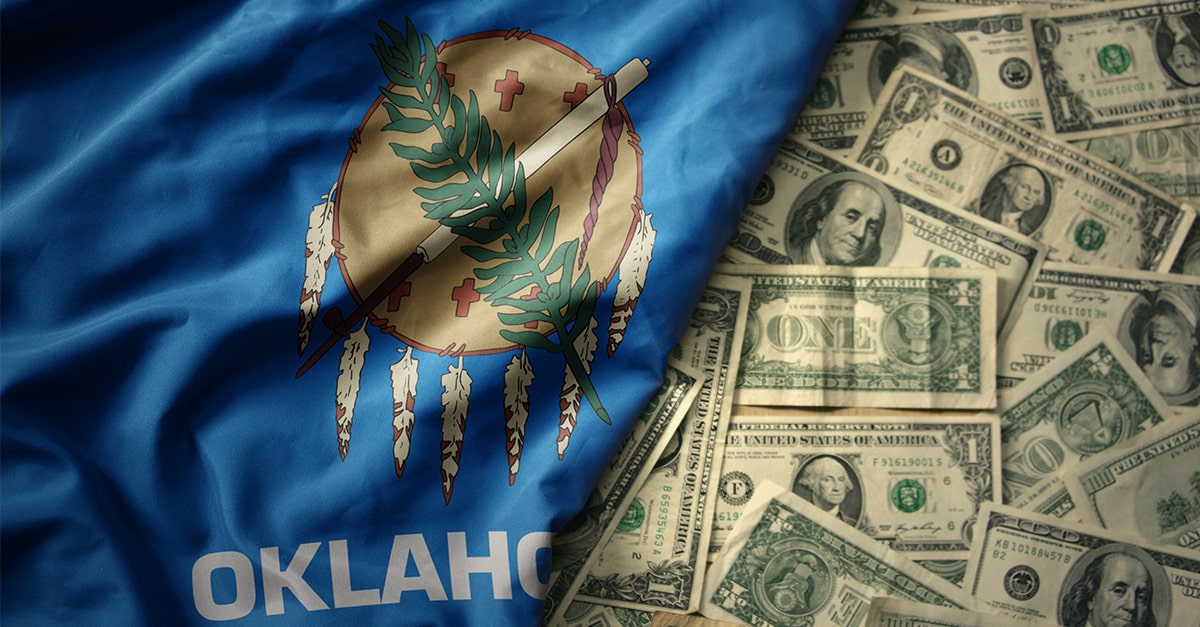 Oklahoma state flag and a pile of paper money